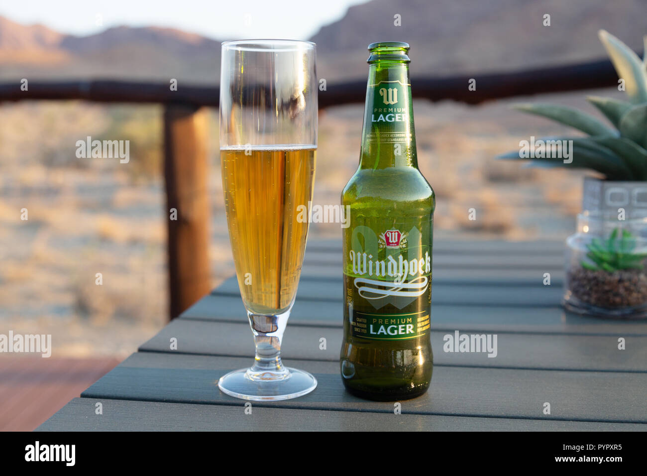 Namibia beer - Windhoek lager bottle and glass, in Namibia Africa Stock Photo