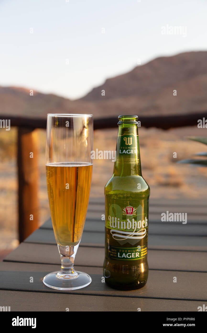 Namibia beer - Windhoek lager bottle and glass, in Namibia Africa Stock Photo