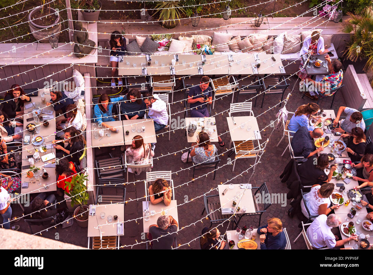 july 07 2018 Biarritz , France . People having dinner on one of the many terrace restaurants  in Biarritz, France Stock Photo