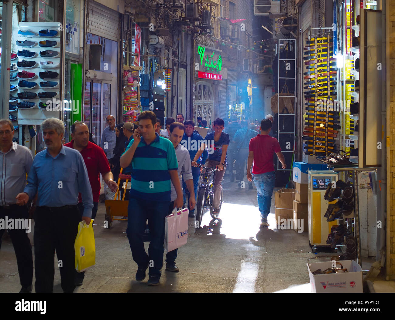 TEHRAN, IRAN - MAY 22, 2107: People at Tehran Grand Bazaar. The Grand Bazaar is an old historical market in Tehran. Stock Photo