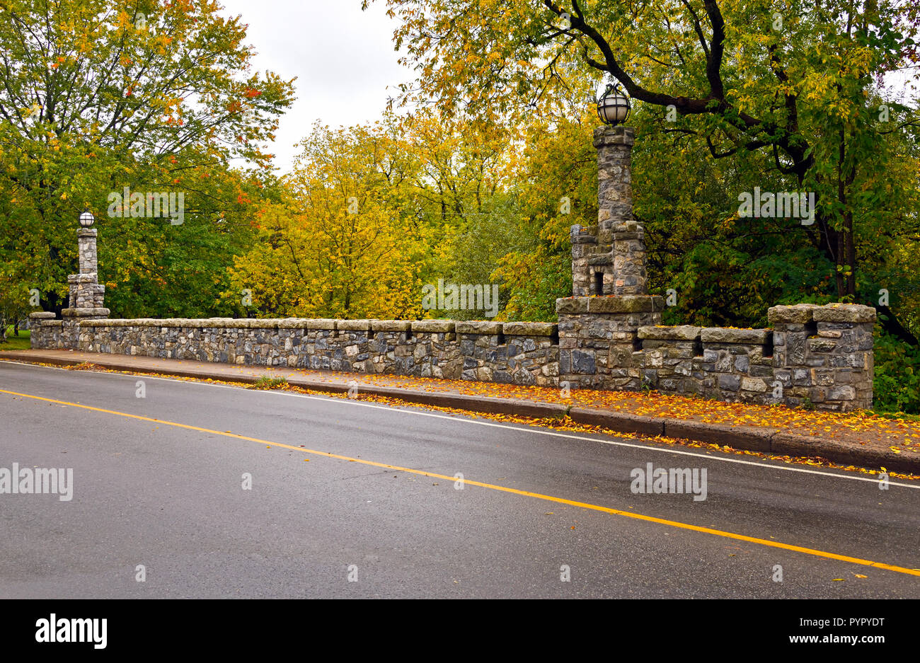 A close up of one side of the iconic stone bridge crossing a creek on the main street in Sussex New Brunswick Canada. Stock Photo