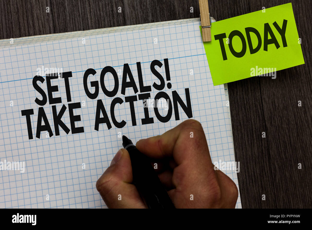 Word writing text Set Goals Take Action. Business concept for Act on a specific and clearly laid out plans Man holding marker notebook clothespin hold Stock Photo