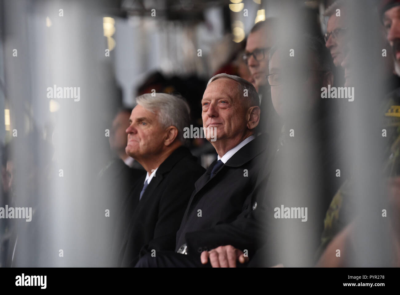 U.S. Secretary of Defense James N. Mattis observes a parade celebrating the Czech centennial, flanked by (left) U.S. ambassador to the Czech Republic, Stephen King, and (right) Czech minister of Defense, Lubomir Metnar, Prague, Czech Republic, Oct. 28, 2018. Members of the Nebraska and Texas National Guards marched in a Joint Color Guard. (DOD photo by Lisa Ferdinando) Stock Photo