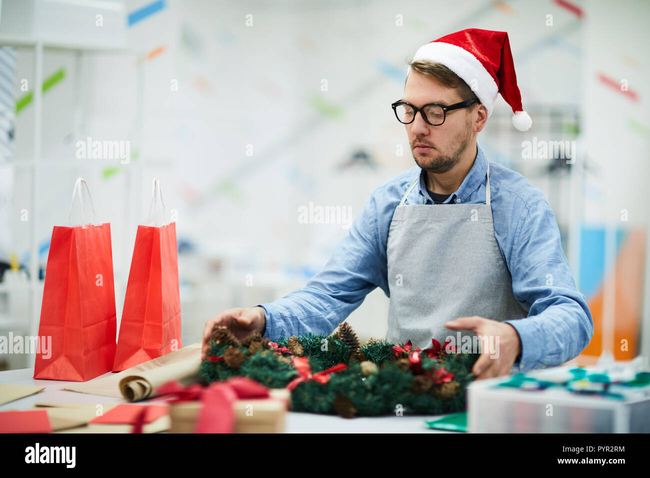 Real elf making Christmas wreath Stock Photo - Alamy