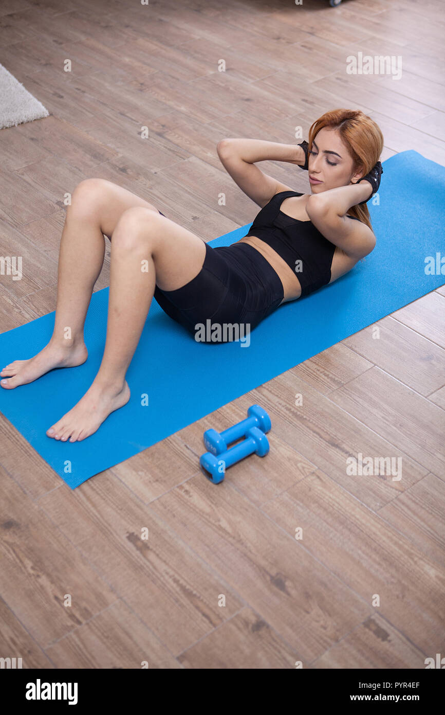 Girl Doing Abs Crunches During Her Home Training No Pain No Gains