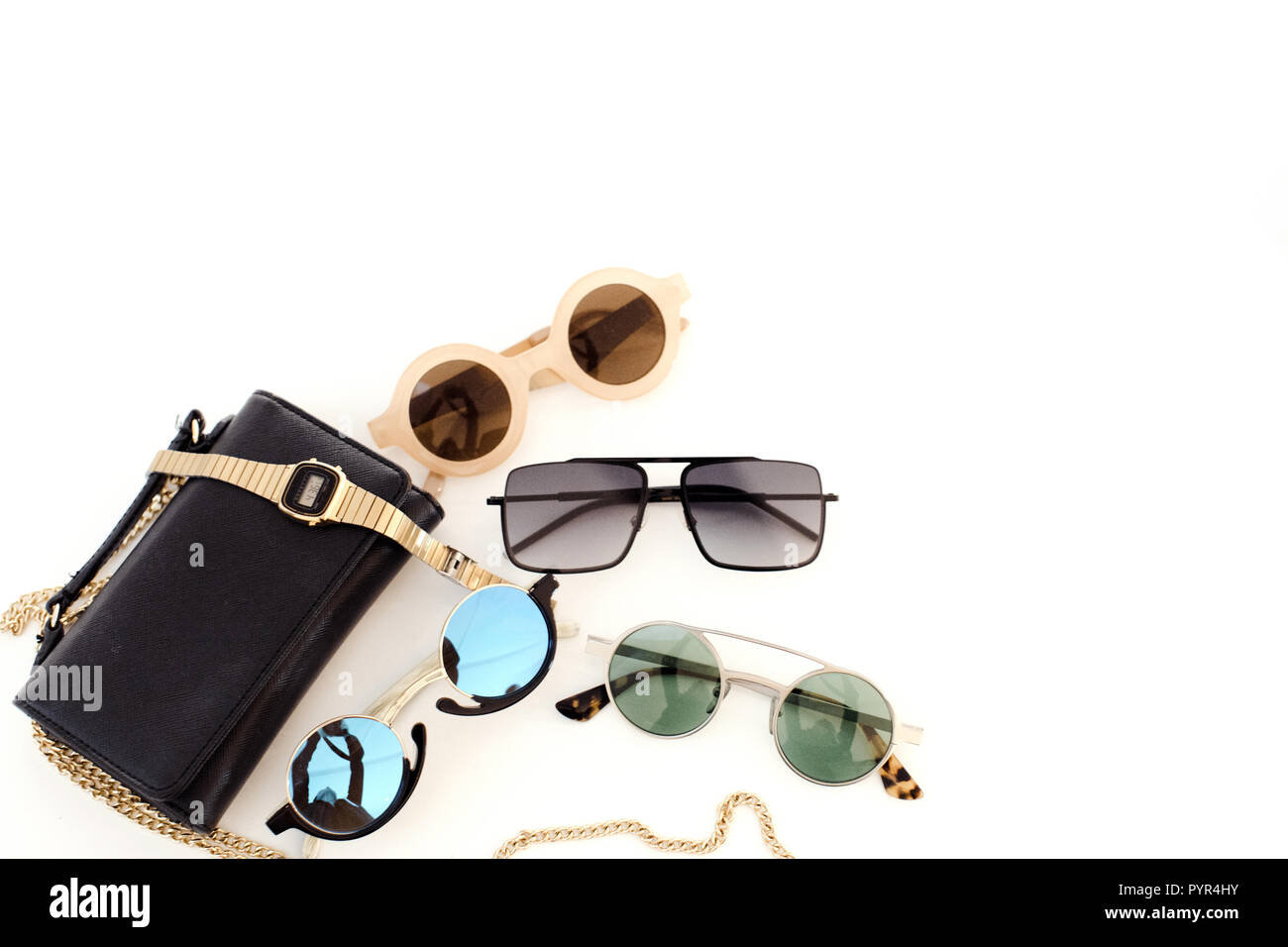 Different sunglasses and handbag Stock Photo