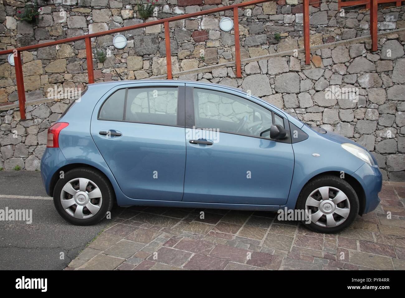 GRAN CANARIA, SPAIN - DECEMBER 5, 2015: Toyota Yaris economy car parked in Gran Canaria, Spain. There are 593 cars per capita in Spain. Stock Photo