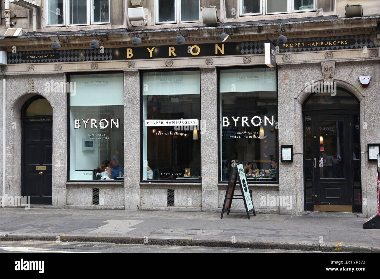 LONDON, UK - JULY 9, 2016: People visit Byron hamburger restaurant in London. According to Tripadvisor there are at least 20,700 restaurants in London Stock Photo
