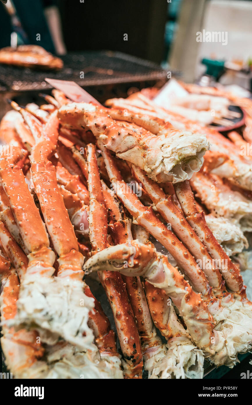 tasty seafood in japanese traditional market. Organic Alaskan King Crab Legs on the mobile vendor. fresh food from ocean concept. Stock Photo