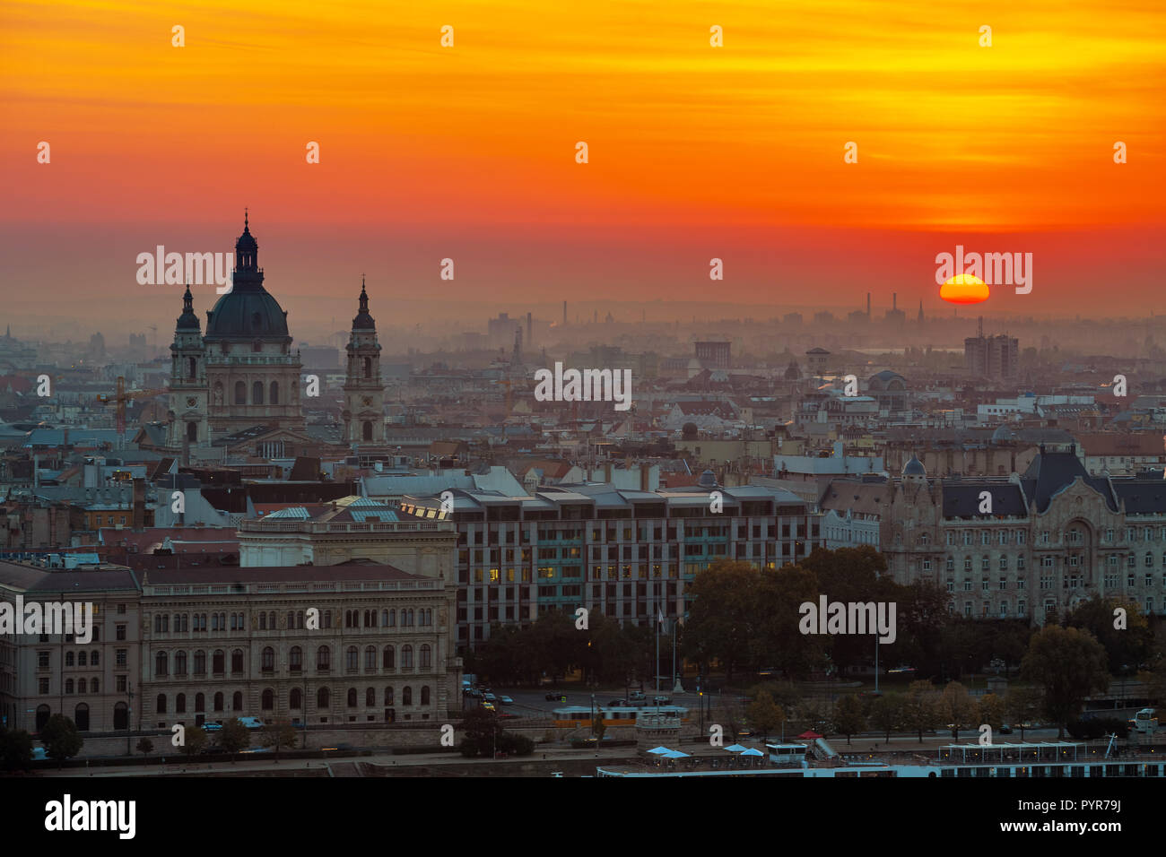 Budapest, Hungary - Beautiful golden sunrise over Budapest with St. Stephen's Basilca and the skyline of Pest Stock Photo