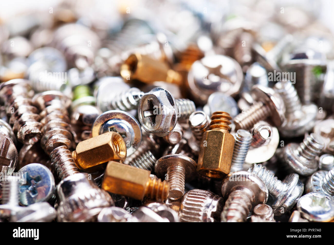Computer screws background, hardware, bolts, nuts, selective focus