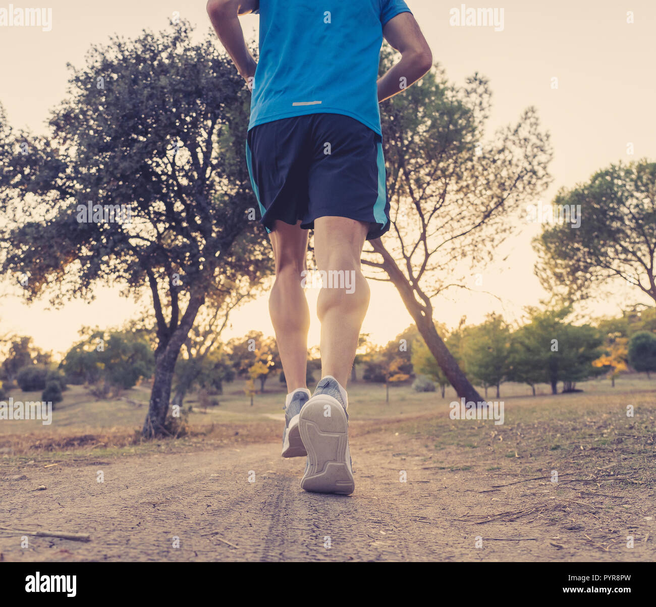Back view Back view of young dynamic athlete runner man with fit strong