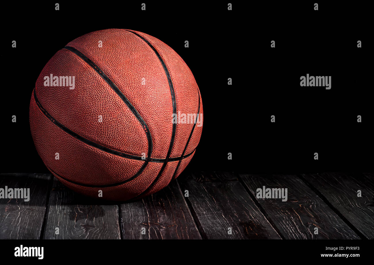 Basketball ball on a wooden floor Stock Photo