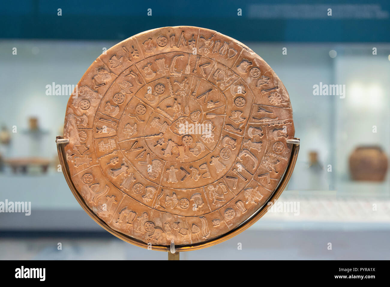 The inscribed Phaistos Disc (17th century BC), Heraklion Archaeological Museum, Heraklion (Irakleio), Irakleio Region, Crete (Kriti), Greece Stock Photo