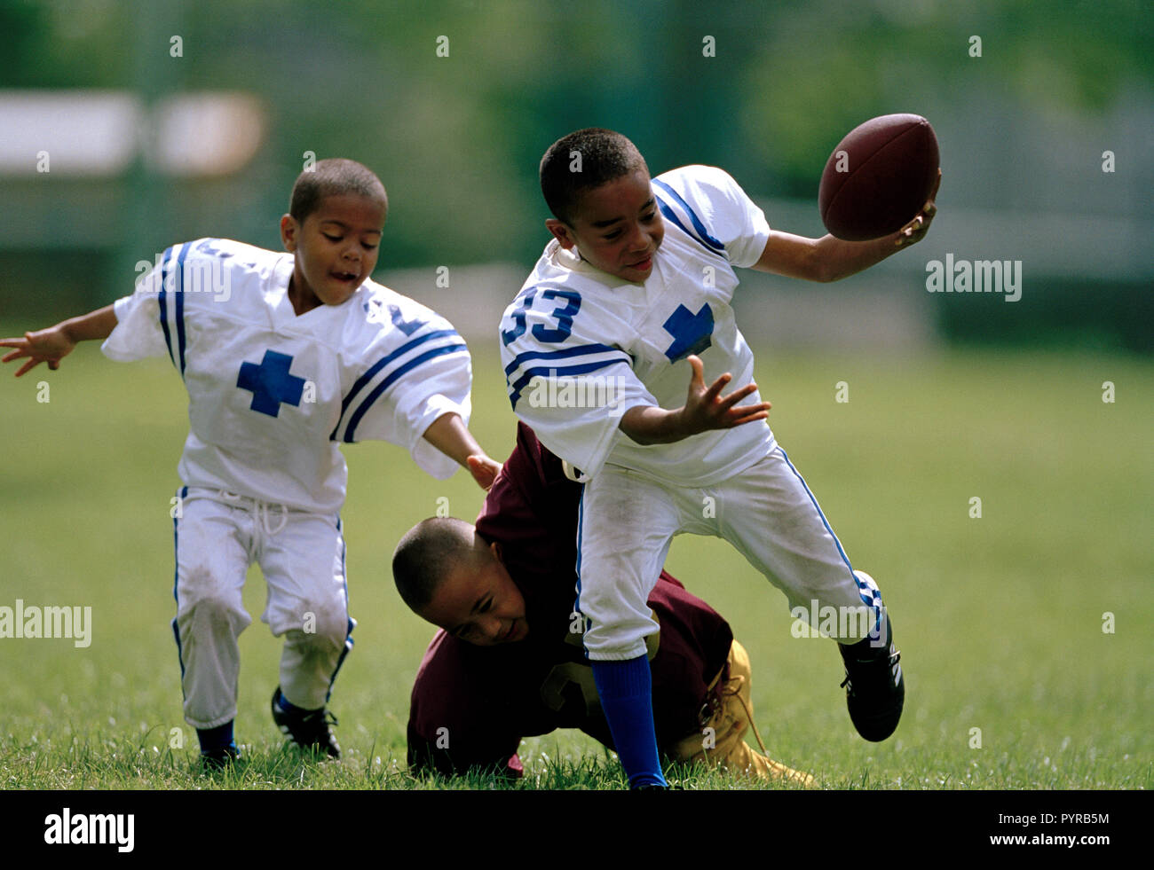 Young boys playing American Football Stock Photo Alamy