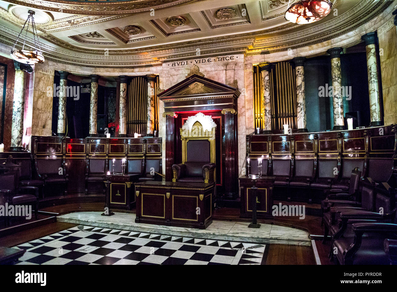 Opulent marble interior of the Masonic Temple at the Andaz Hotel with Audi Vide Tace (Hear, See, Hush) latin quote above the throne, London, UK Stock Photo