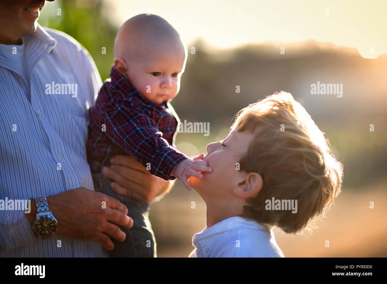 young baby touching his