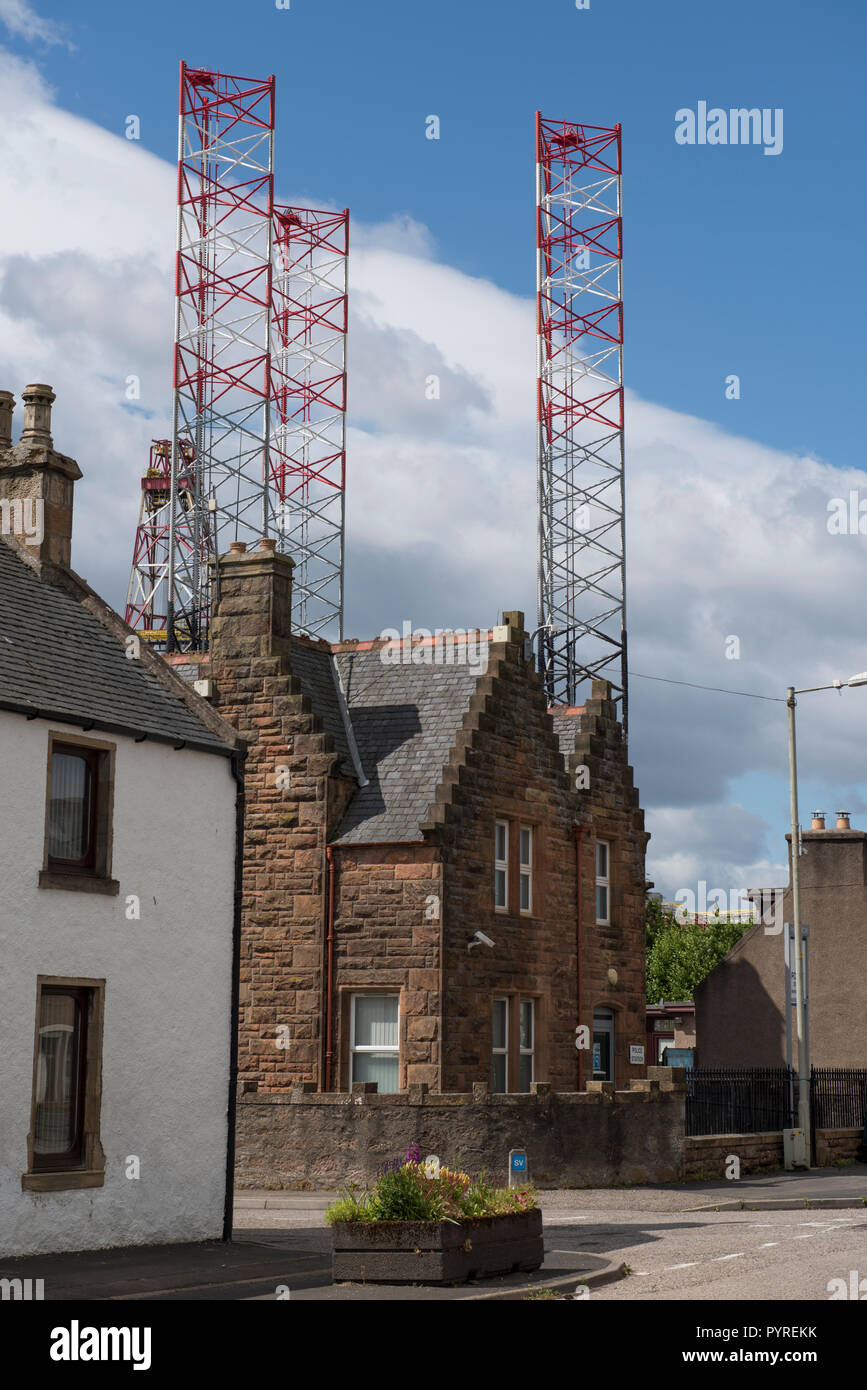 Drilling rig towering above buildings in the High Street, Invergordon