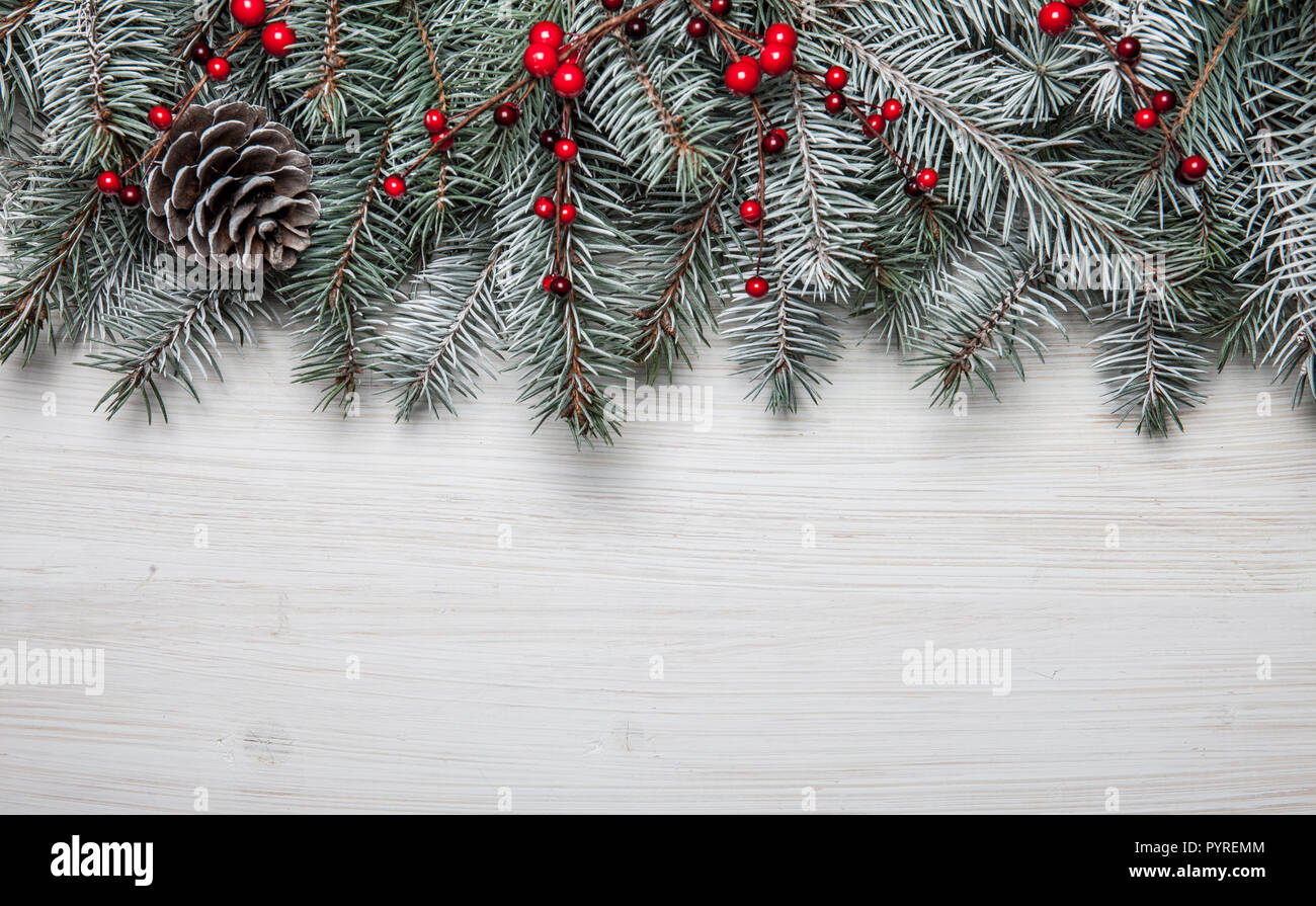 Christmas wooden background with snow fir tree and decoration. Top view ...