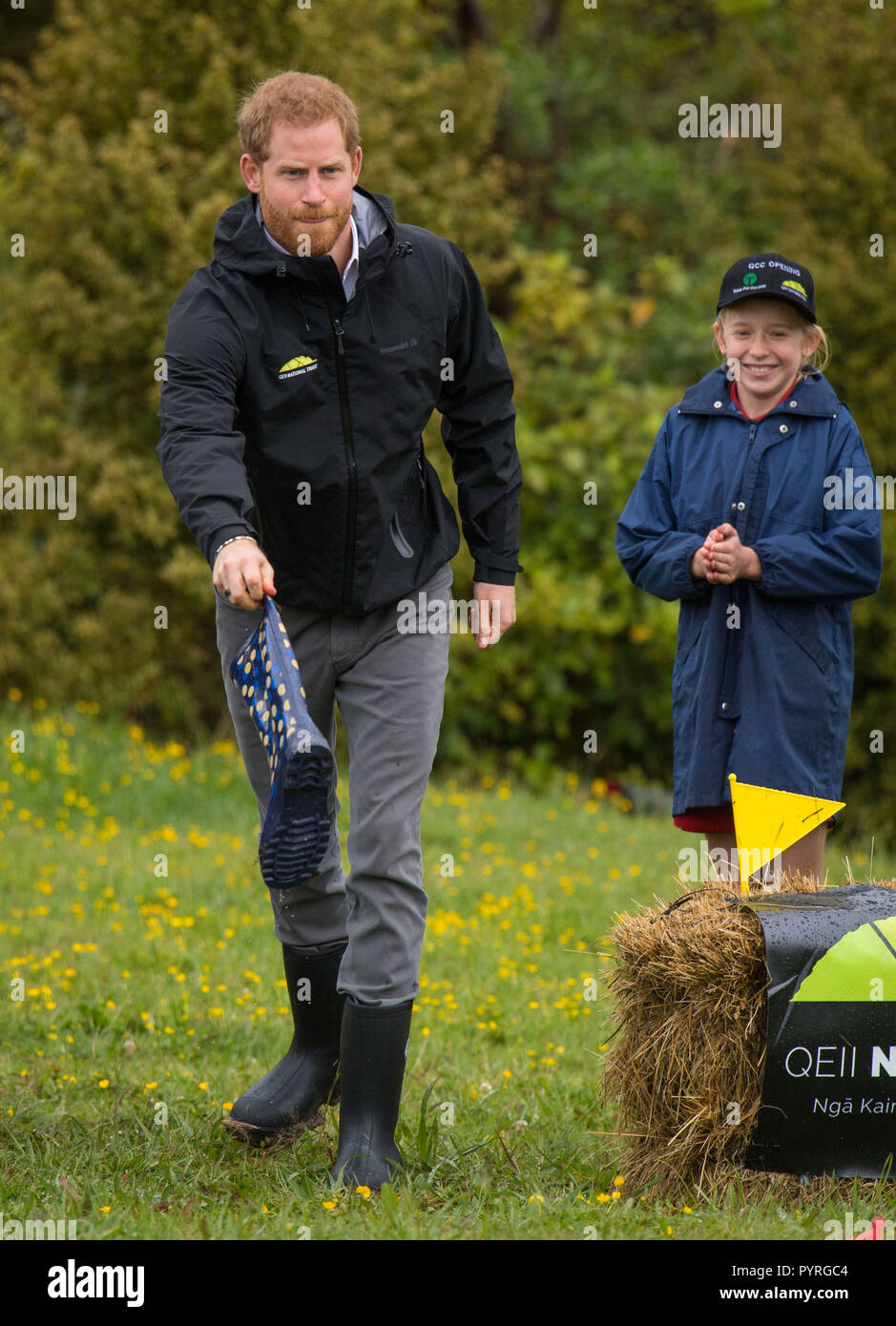 The Duke of Sussex takes part in a welly wanging contest following a dedication of an area of bush to the Queen's Commonwealth Canopy, in Redvale on the North Shore, on day three of the royal couple's tour of New Zealand. Stock Photo