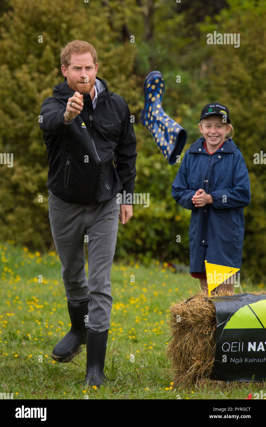 The Duke of Sussex takes part in a welly wanging contest following a dedication of an area of bush to the Queen's Commonwealth Canopy, in Redvale on the North Shore, on day three of the royal couple's tour of New Zealand. Stock Photo