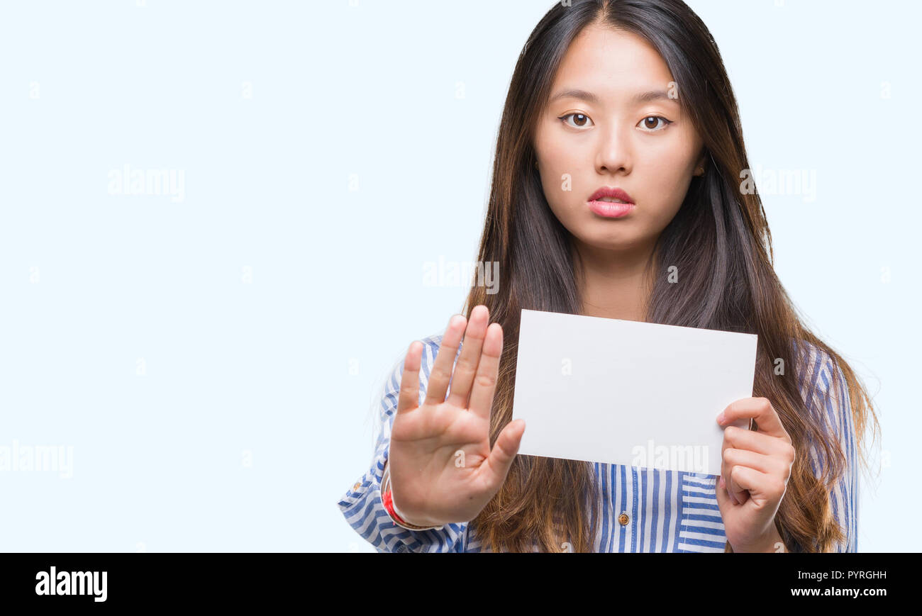 young asian woman holding blank card over isolated