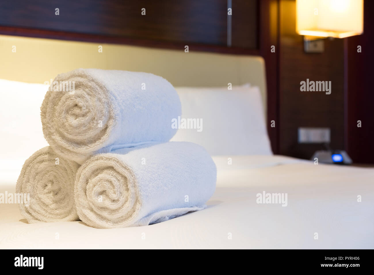 White towel on bed decoration in bedroom interior Stock Photo Alamy