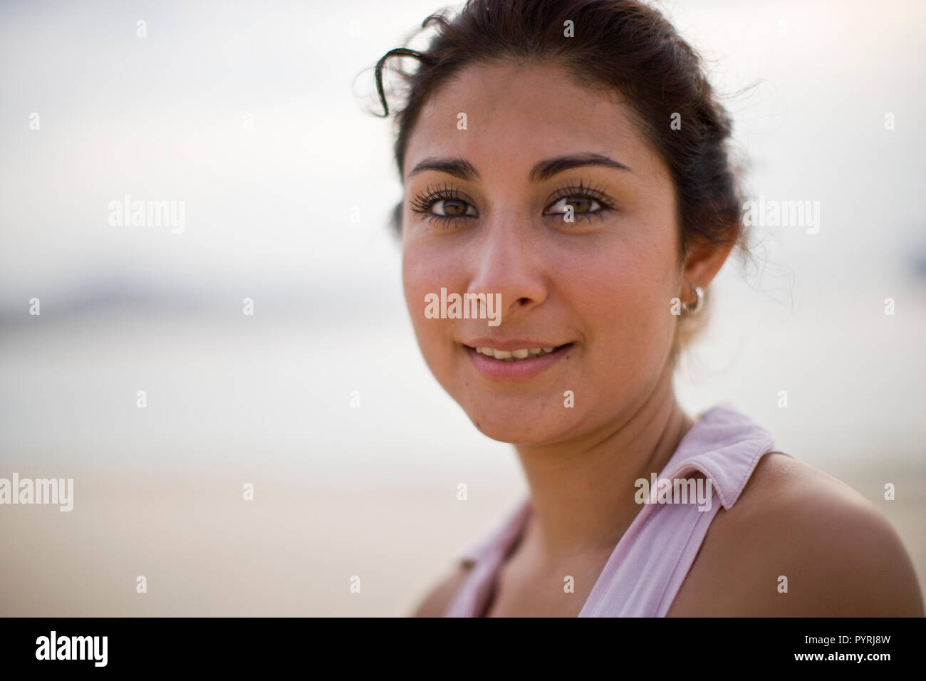 Portrait of young woman wearing pink top Stock Photo