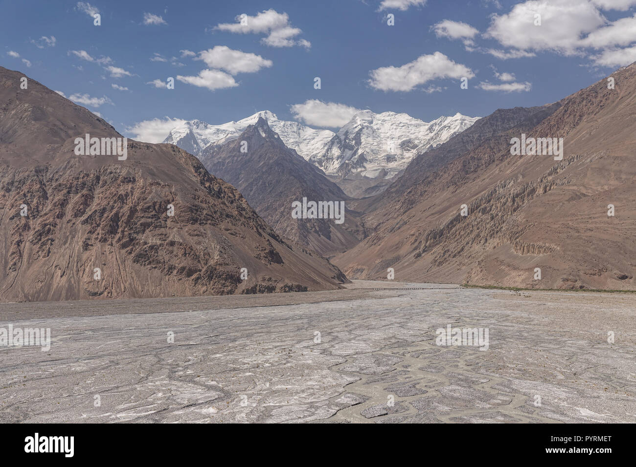 Alluvial fan formed by sediment from glaciers spilling off Kohe Hevad mountain, Wakhan Valley, Afghanistan Stock Photo