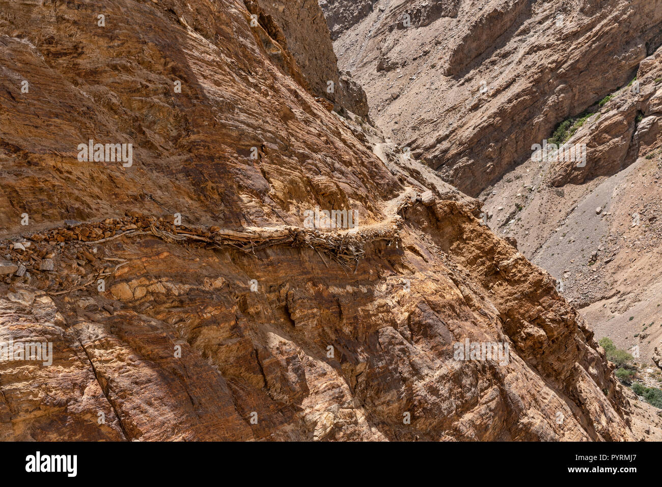 Old herders trail clinging to cliff face in Darshai gorge, known as Darshai Dara, Darshai, Wakhan Valley, Tajikistan Stock Photo