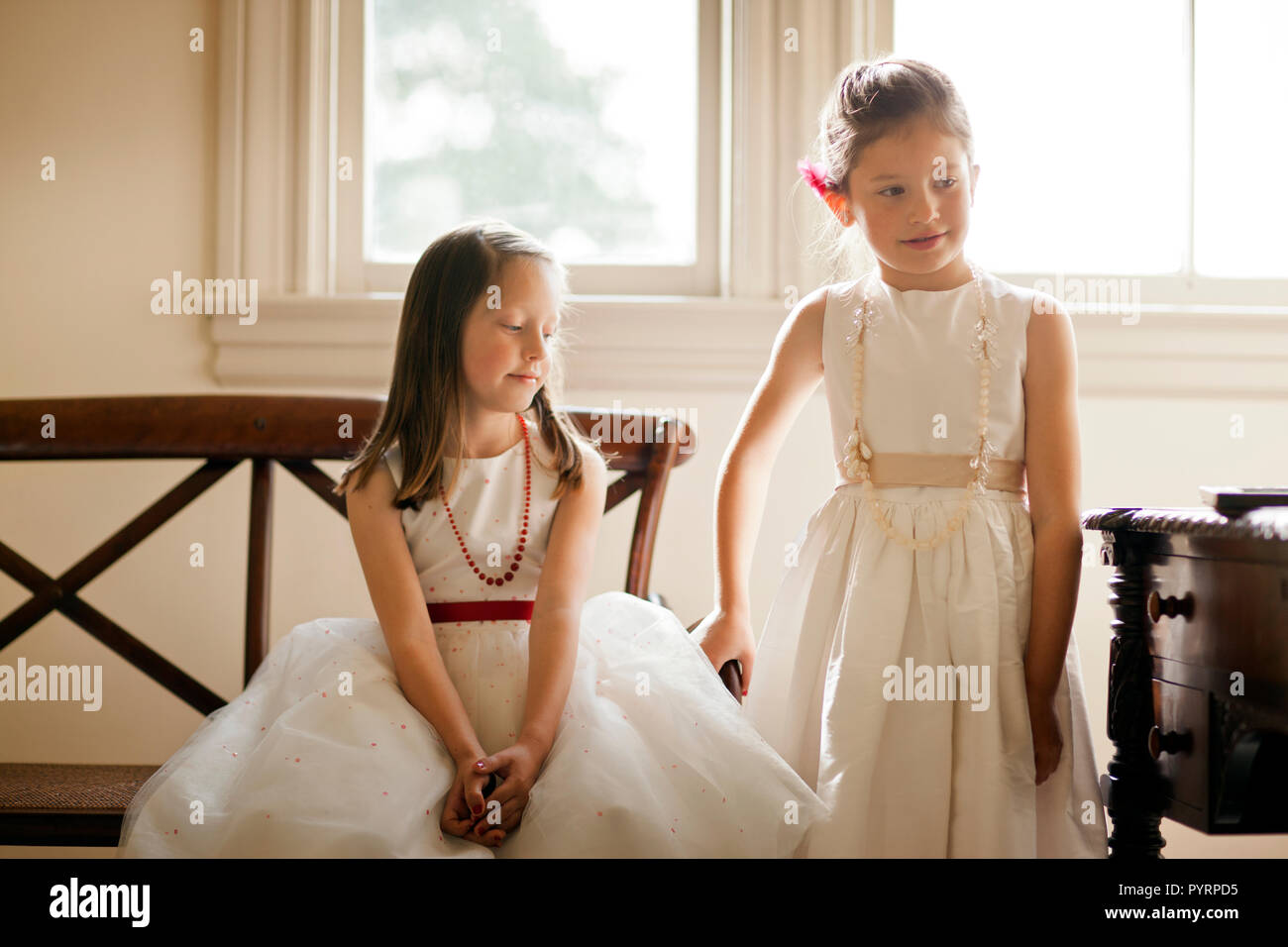 Two young girls wearing pretty images. Stock Photo