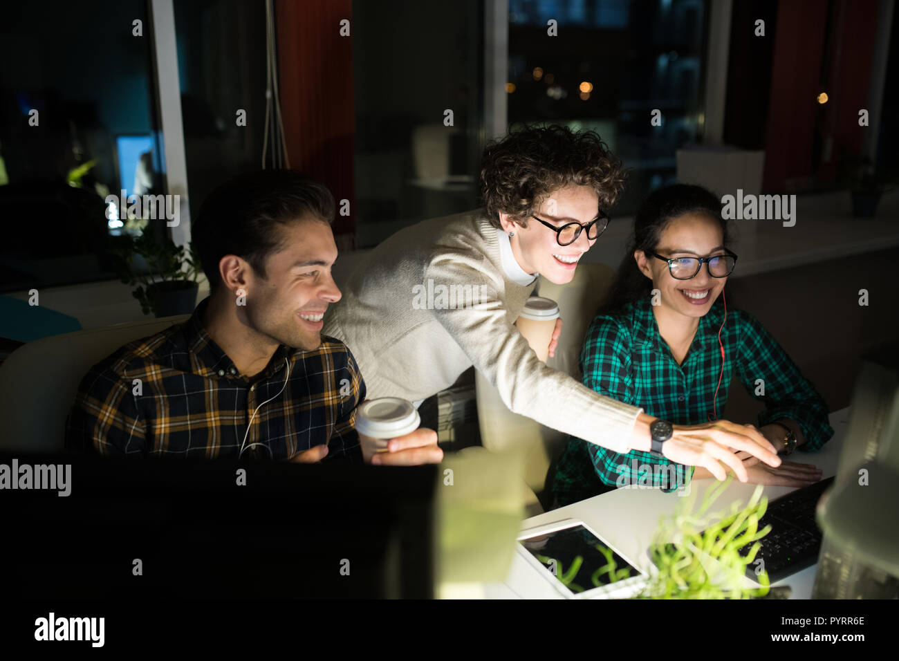 Young Entrepreneurs Working at Night Stock Photo