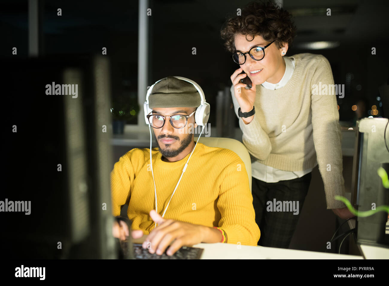 People Working Late in Office Stock Photo