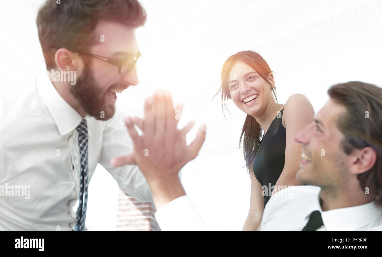business colleagues giving each other high five Stock Photo - Alamy