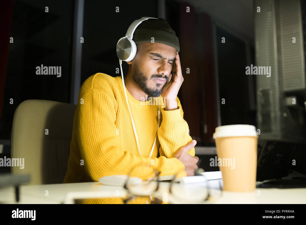 Stressed Young Man at Work Stock Photo