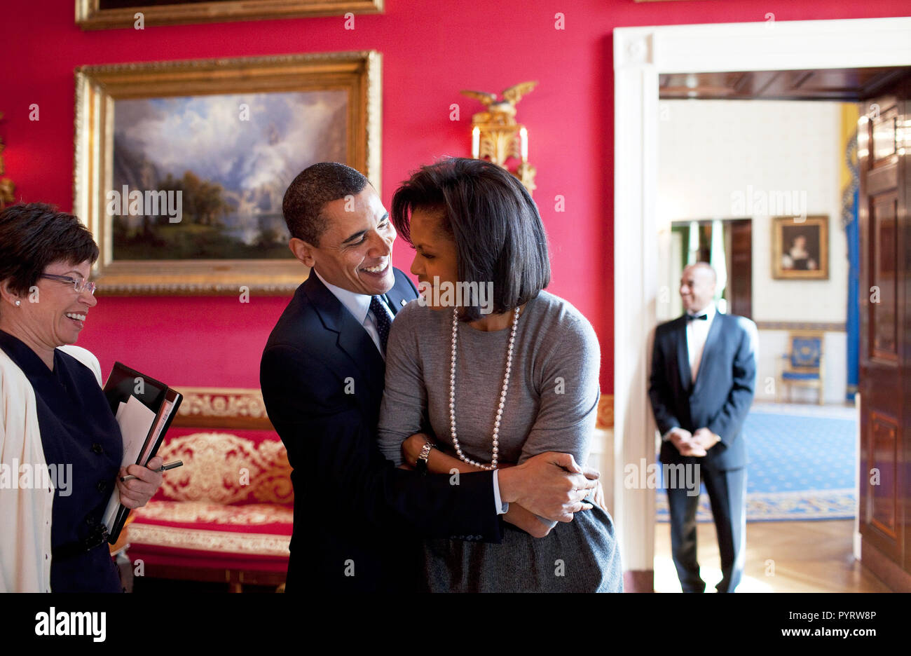 President Barack Obama hugs First Lady Michelle Obama in the Red