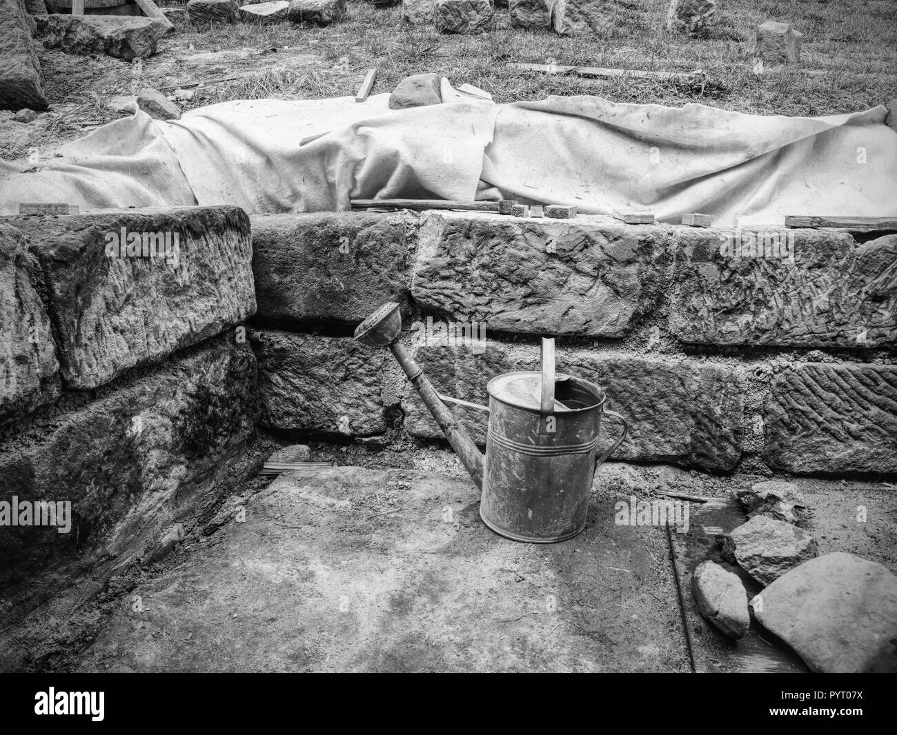 Natural stone wall, sandstone texture. Using of historical soft sand stones prepare for rebuilding of old house. Stock Photo