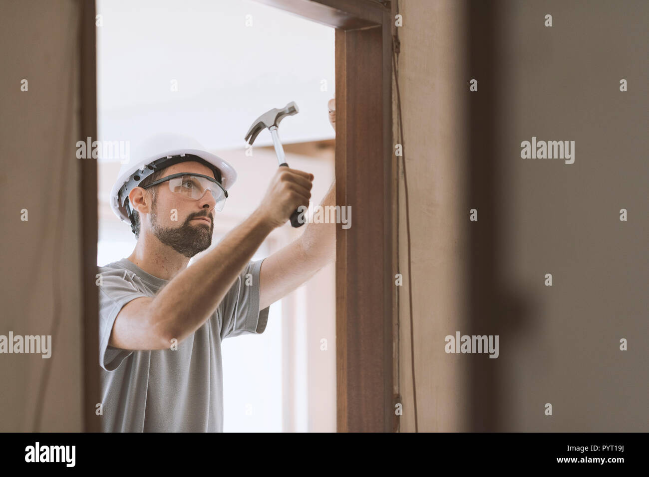 Professional Carpenter Installing A Door Jamb Home Renovation And