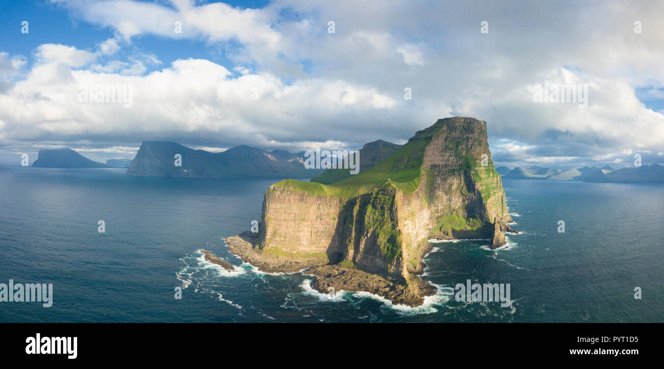 Aerial panoramic of Kallur lighthouse and cliffs, Kalsoy island, Faroe Islands, Denmark Stock Photo