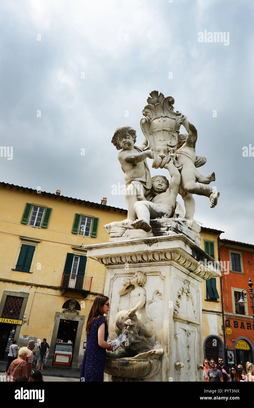 The Three angles statue and fountain in Pisa, Italy. Stock Photo