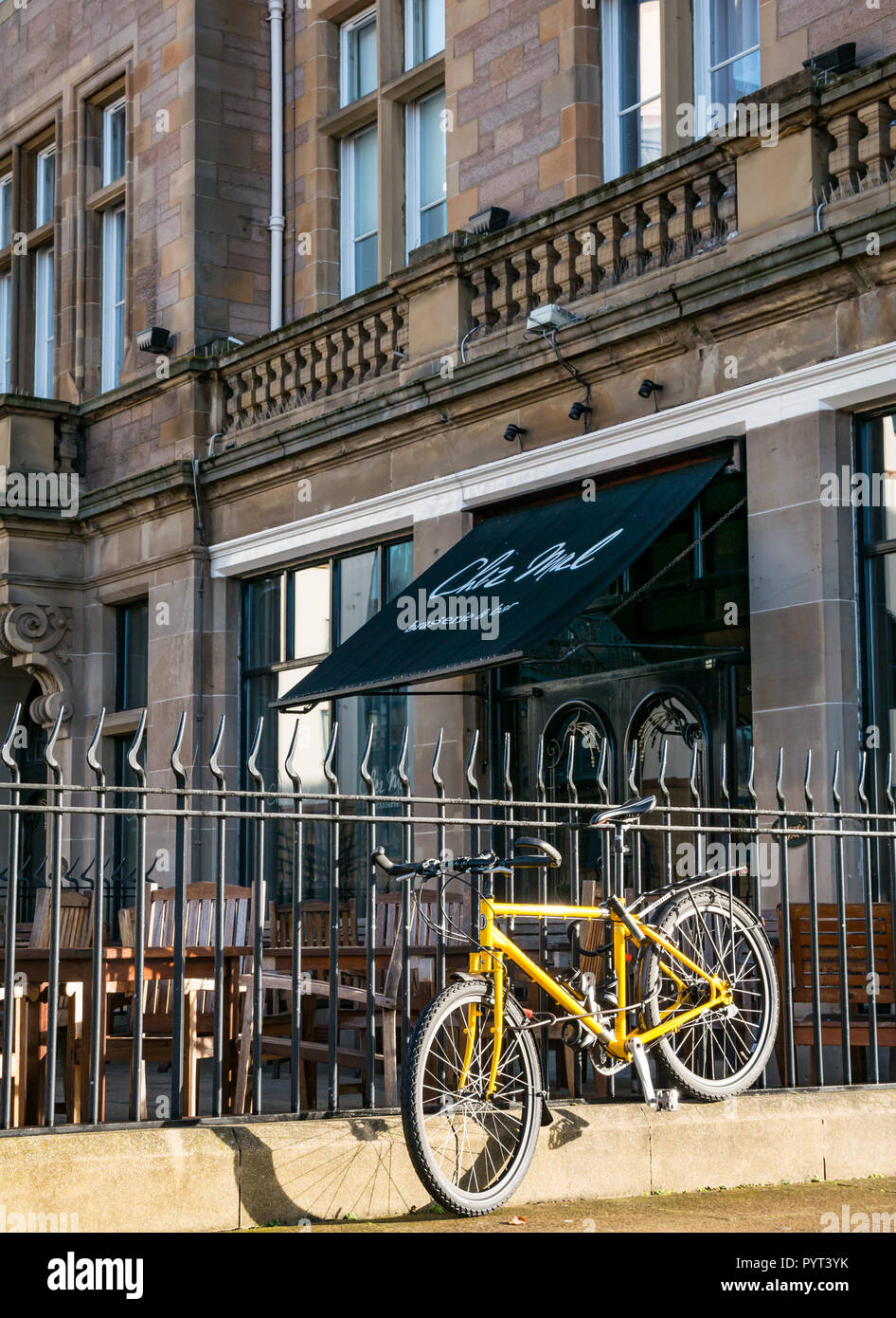 Front of Chez Mal brasserie restaurant at Malmaison Hotel with yellow bicycle locked to railings, The Shore, Leith, Edinburgh, Scotland, UK Stock Photo