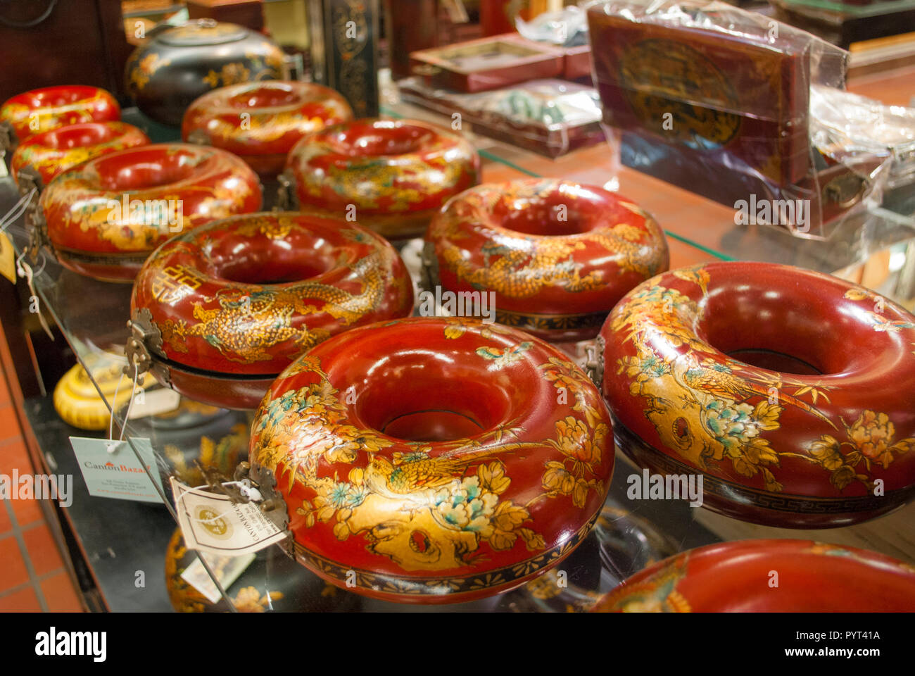 A lot of Chinese special bright colored caskets close-up. Celebration parts. Ancient traditional tools. Stock Photo