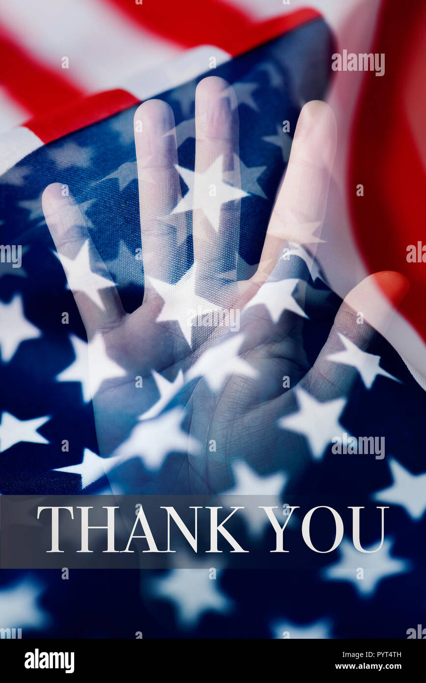 multiple exposure of some flags of the United States and the hand of man, and the text thank you Stock Photo