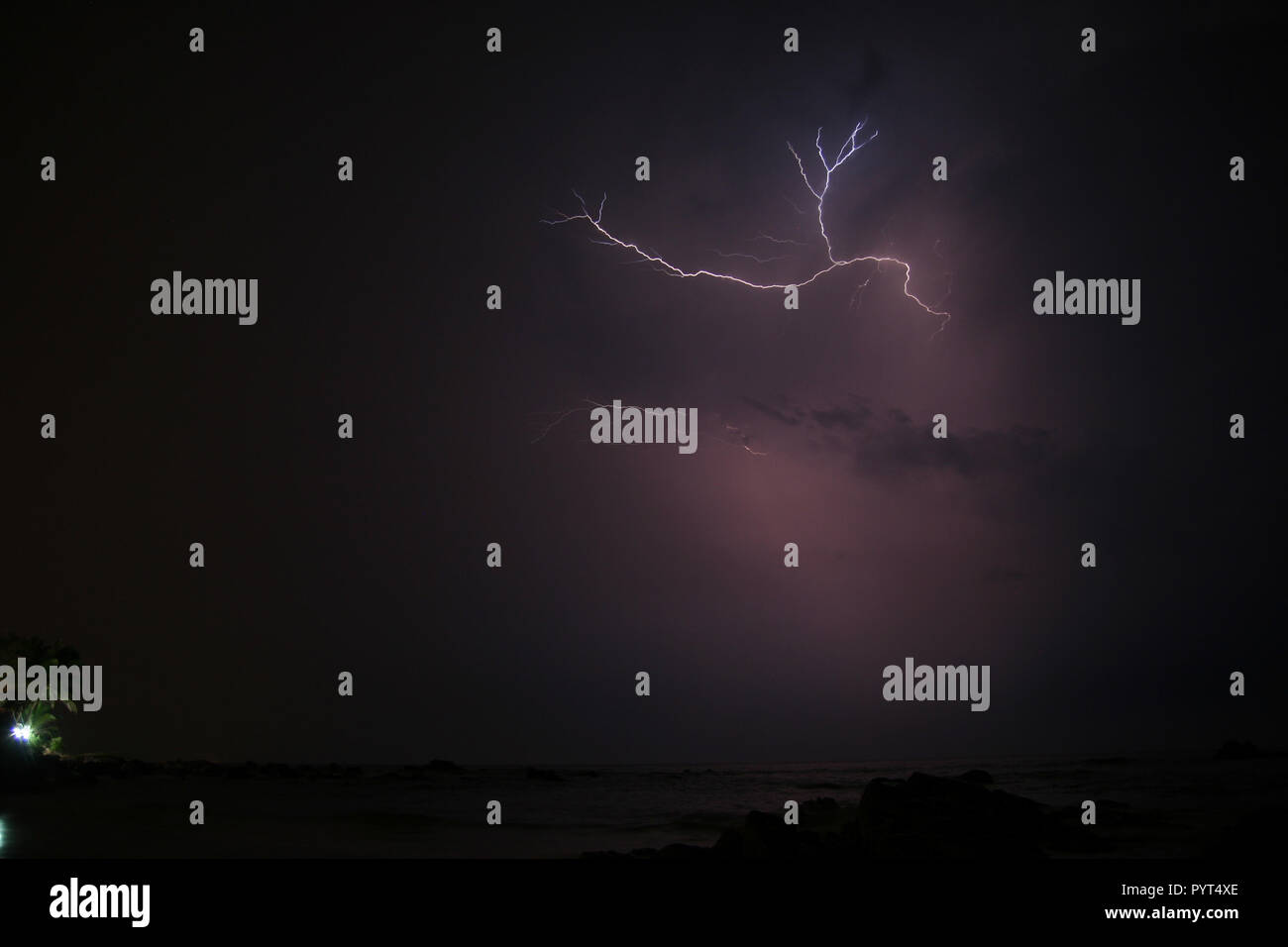 Small lightning strike in sky Stock Photo