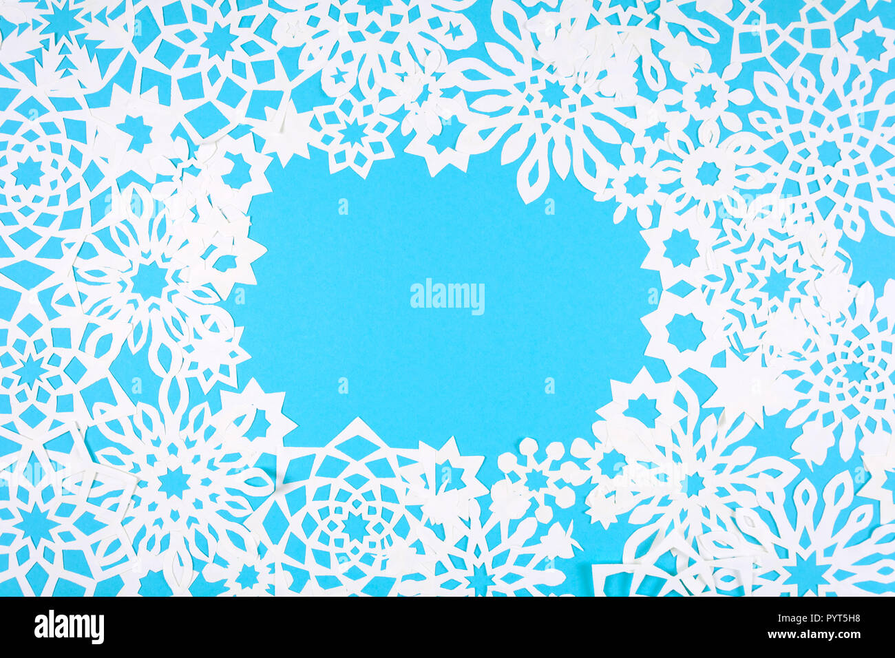 Paper snowflakes frame on blue background. Top view. Christmas ...