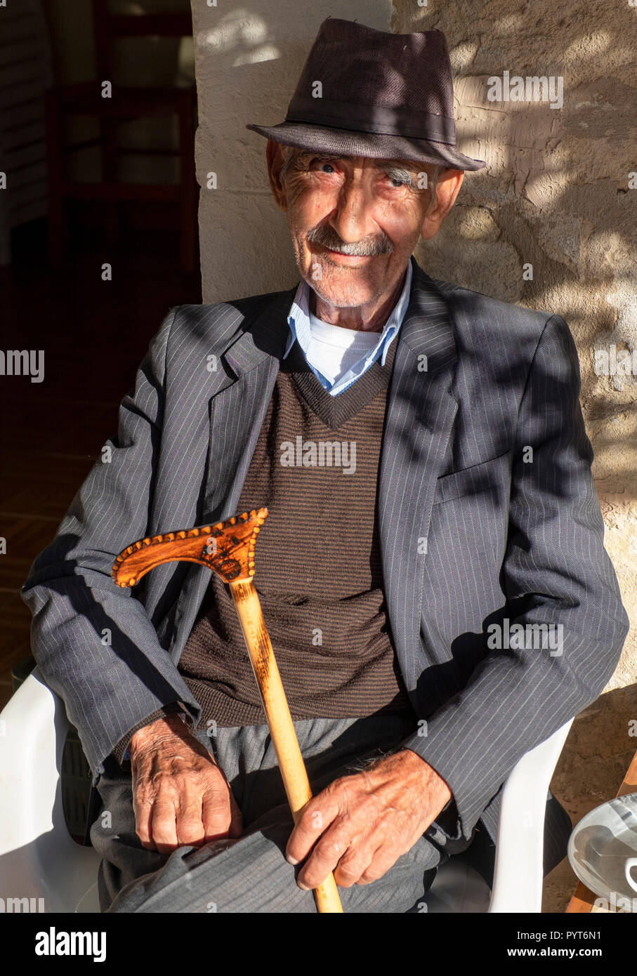Portrait of an  elderly Cypriot man sitting outside a taverna in the village of  Letymvou, near Paphos, Cyprus Stock Photo