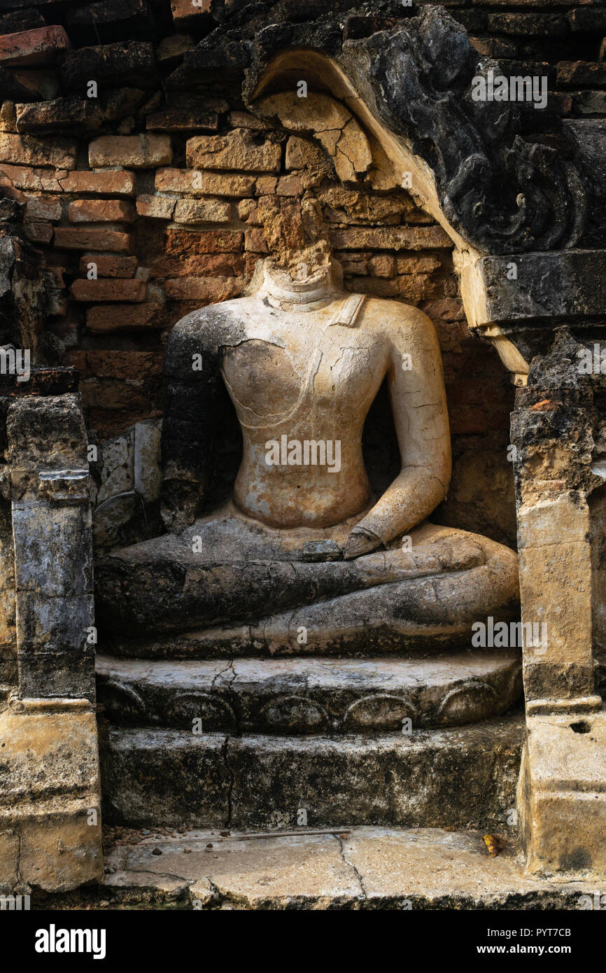 Ruins of ancient buddha statue at sukhothai unesco world heritage site or Sukhothai Historical Park, Sukhothai Province, Thailand Stock Photo