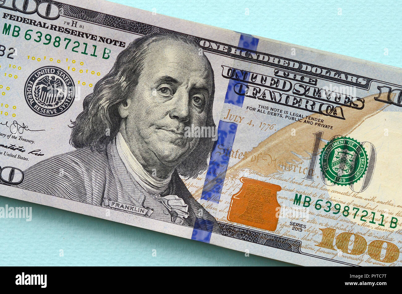 skelet svag hænge US dollar bills of a new design with a blue stripe in the middle is lies on  a light blue background Stock Photo - Alamy