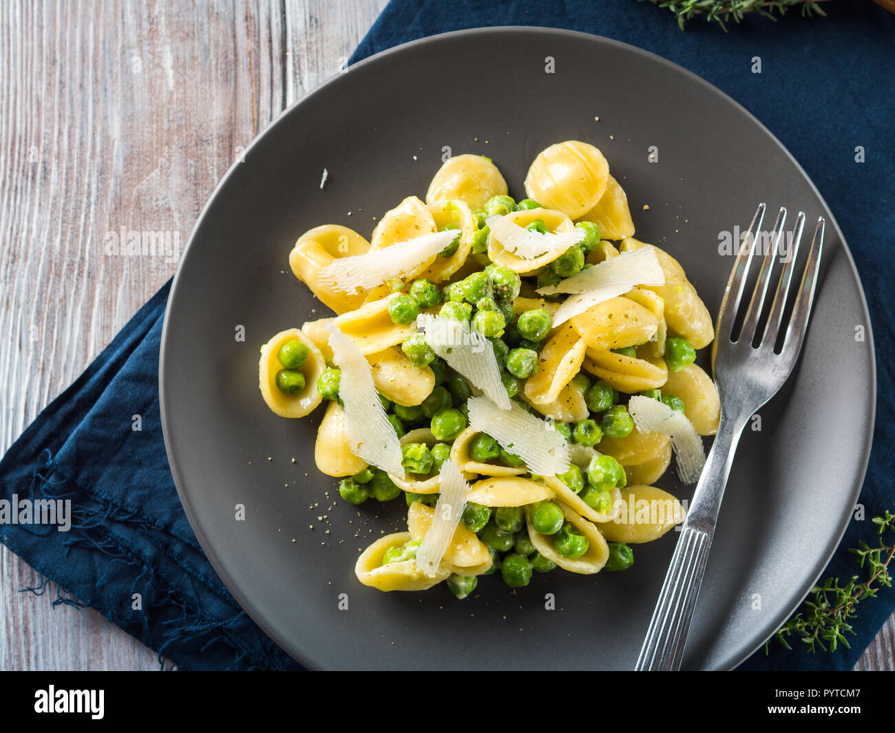 Italian orecchiette pasta with peas, cream and pecorino cheese Stock