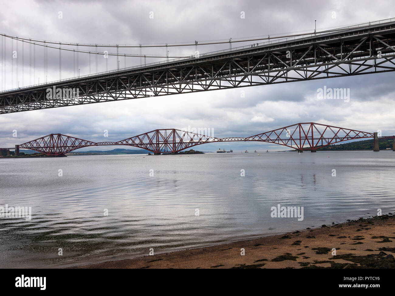 The Old Forth Road Bridge and the Forth Rail Bridge over the Firth of Forth in Queensferry, Edinburgh Scotland United Kingdom UK Stock Photo